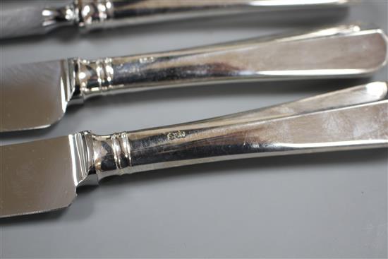 A modern 4 piece silver handled carving set and one hundred and forty three items of plated flatware